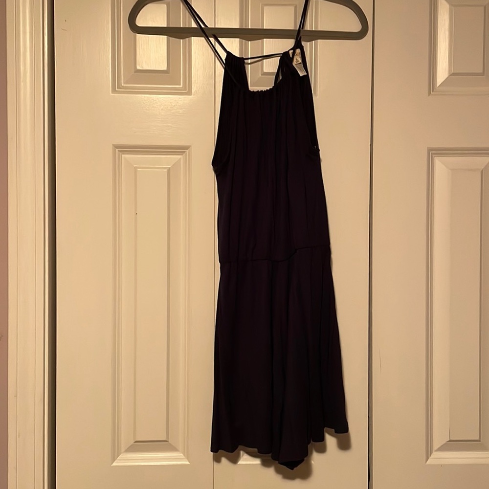 Worn once high neck navy blue romper with adjustable tie in back!